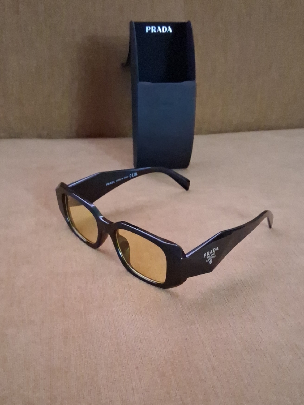Prada Black Frame Sunglasses with Amber Lenses